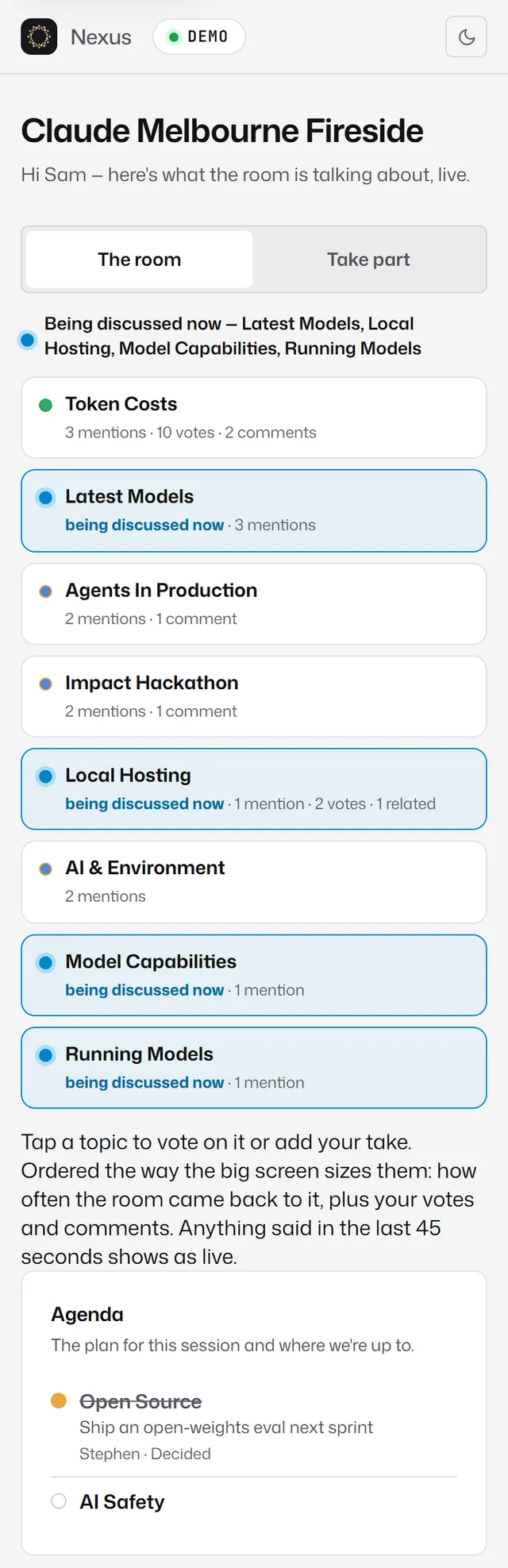 The phone's 'The room' tab listing topics with mentions, votes and comments